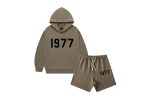 The 1977 Style Essentials Hoodie and Shorts Combo for kids offers a trendy and comfortable outfit. The hoodie features a bold "1977" graphic, while the matching shorts provide a relaxed fit, making it perfect for casual wear.