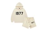 The 1977 Style Essentials Hoodie and Shorts Combo for kids in white offers a fresh and trendy look. Featuring a classic "1977" graphic on the hoodie, this set is made from soft, comfortable fabric perfect for everyday wear.