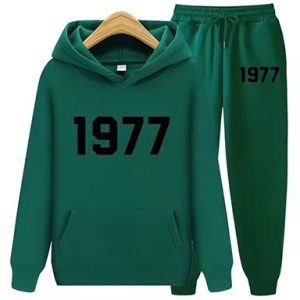 Shop the 1977 Essentials Iconic Tracksuit for Women In Green. Modern, comfortable, and stylish activewear perfect for workouts or casual outings.