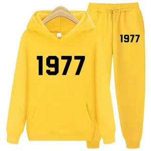 Shop the 1977 Essentials Trendy Women’s Tracksuit in yellow. Perfect for workouts or casual wear, offering style, comfort, and a flattering fit.
