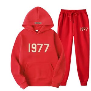 Shop the Oversized 1977 Essentials Tracksuit in Red for a perfect blend of comfort and style. Crafted with a soft cotton-polyester blend