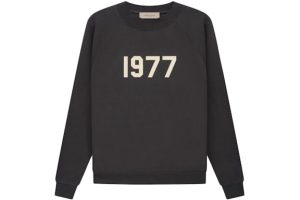 Shop the Fear of God Essentials 1977 Crewneck in iron. Soft, durable, and stylish, perfect for casual wear with a cozy, modern design.