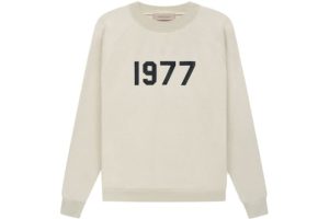 Shop the Fear of God Essentials 1977 Crewneck in Wheat. Soft, durable, and stylish, perfect for casual wear with a cozy, modern design.