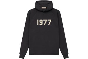 Shop the Fear of God Essentials 1977 Knit Hoodie Iron. Cozy knit fabric, adjustable hood, and a perfect blend of style and comfort.