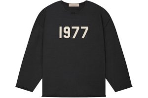Shop the Fear of God Essentials 1977 Raw Edge Sweater in Iron. Soft, durable, and stylish with raw edge details for a modern, cozy look.