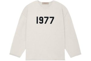 Shop the Fear of God Essentials 1977 Raw Edge Sweater in Wheat. Soft, durable, and stylish with raw edge details for a modern, cozy look.
