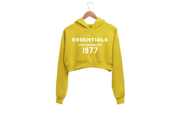Shop the 1977 Essentials Crop Hoodie for women. A cozy, cropped design with retro 1977 graphic. Perfect for casual and athleisure wear.