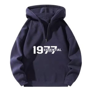 The 1977 Essential Half-Zip Hoodie in Cozy Blue offers a relaxed fit and soft fabric, combining classic style with everyday comfort.