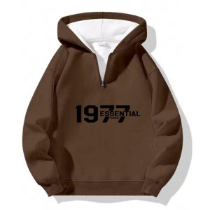 The 1977 Essential Half-Zip Hoodie in Cozy Brown. A classic comfortable wardrobe staple perfect for everyday style and ultimate warmth.