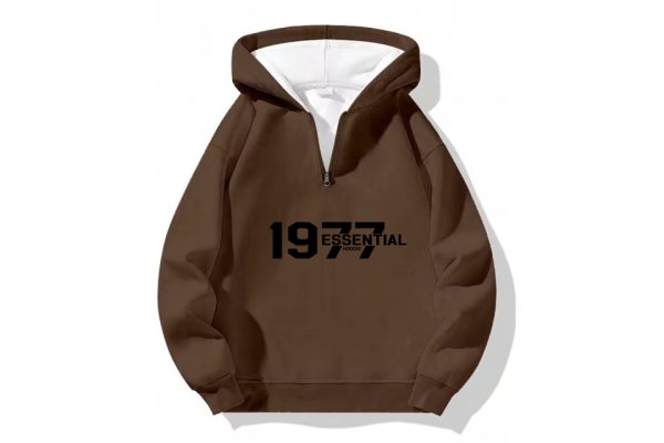 The 1977 Essential Half-Zip Hoodie in Cozy Brown. A classic comfortable wardrobe staple perfect for everyday style and ultimate warmth.