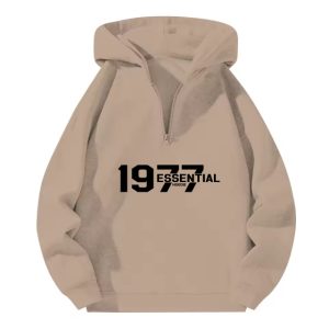 The 1977 Essentials Half-Zip Hoodie in Cozy Beige offers a stylish, relaxed fit with soft fabric, perfect for casual comfort and versatile styling.