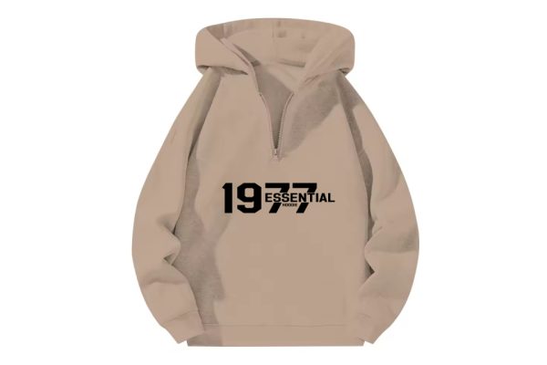 The 1977 Essentials Half-Zip Hoodie in Cozy Beige offers a stylish, relaxed fit with soft fabric, perfect for casual comfort and versatile styling.