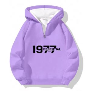 The 1977 Essentials Half-Zip Hoodie in Cozy Purple combines premium comfort, relaxed fit, and timeless style, perfect for casual everyday wear.
