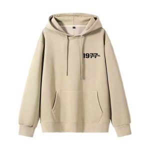 The 1977 Essentials Hoodie in Beige combines minimalist design, cozy fit, and versatility, making it the perfect addition to any casual wardrobe.