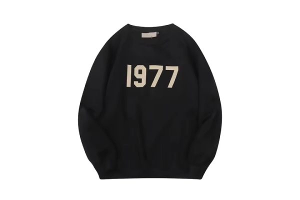 Shop the 1977 Essentials Sweatshirt in Black for premium comfort, durability, and style. Perfect for casual outings, lounging, and everyday wear