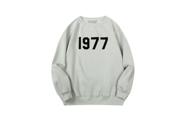 Shop the 1977 Essentials Sweatshirt in Light Gray. Soft cotton fleece, classic fit, ribbed cuffs, and durable design for ultimate comfort and style.