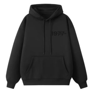 1977 Essentials Hoodie in Timeless Black, a classic wardrobe staple designed for ultimate comfort and style. Perfect for any occasion.