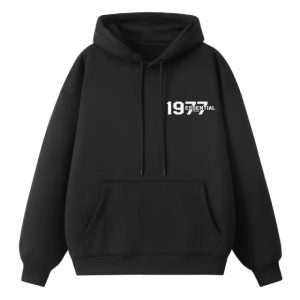 The 1977 Essentials Hoodie in black. Designed for ultimate comfort and sleek simplicity, it’s the perfect addition to any wardrobe.