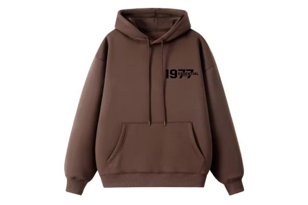 The 1977 Essentials Hoodie, where simplicity meets style. Crafted for comfort and versatility, this hoodie is the perfect addition to any wardrobe