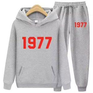 Shop the 1977 Essentials Iconic Tracksuit for Women in gray with red logo. Stylish, comfortable, and perfect for active lifestyles.