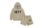 The 1977 Style Essentials Hoodie and Shorts Combo for kids in grey offers a cool, casual look with a "1977" graphic on the hoodie. Made from soft, comfortable fabric, it ensures a relaxed fit for active kids.