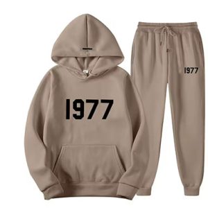 Shop the Oversized 1977 Essentials Tracksuit in Brown with black Logo. Enjoy comfort and style with this trendy, relaxed-fit tracksuit