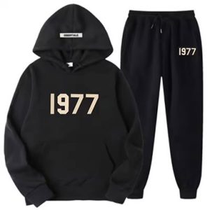 Shop the Oversized 1977 Essentials Tracksuit in Black for a perfect blend of comfort and style. Crafted with a soft cotton-polyester blend