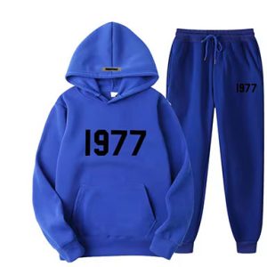 Shop the Oversized 1977 Essentials Tracksuit in Blue for a perfect blend of comfort and style. Crafted with a soft cotton-polyester blend