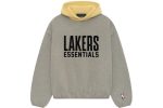 The Essentials NBA Lakers Hoodie in Warm Heather. Featuring bold Lakers branding, this hoodie offers comfort and a trendy look for any fan.