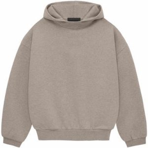 The Essentials Hoodie in Core Heather offers ultimate comfort and style with its soft fabric, relaxed fit, and versatile design for everyday wear.