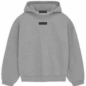 The Essentials Pullover Hoodie (FW23) in Dark Heather Oatmeal offers ultimate comfort and style with a relaxed fit adjustable hood and classic pocket design