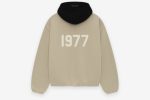 Shop the 1977 Essentials Heat Hoodie. Soft fabric, bold design, and comfortable fit, perfect for showing your team spirit in style.