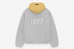 Shop the 1977 Essentials Sparks Hoodie. Soft fabric, bold design, and comfortable fit, perfect for showing your team spirit in style.
