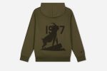 The 1977 NICCE x Billy The Goat Hoodie in Juniper Green blends style and comfort, featuring a unique design perfect for any casual look.