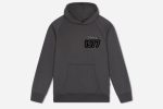 The 1977 NICCE Men's Multi Logo Hoodie in Coal combines comfort and style with its bold logo design, perfect for everyday wear and casual looks.