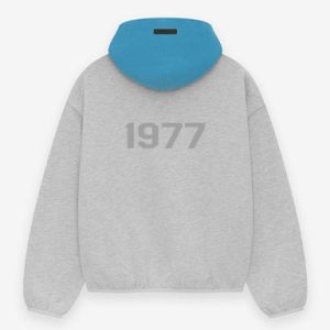 Shop the 1977 Essentials Sky Hoodie. Soft fabric, bold design, and comfortable fit, perfect for showing your team spirit in style.