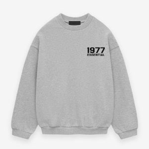 Shop the 1977 Essentials Fleece Crewneck Chest Logo in Desert Sand. Soft cotton, stylish chest logo, ribbed cuffs, and a comfortable fit for everyday wear
