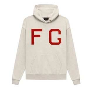 The Essentials Monarch FG Hoodie combines comfort and style with its soft fabric, bold graphic, and practical design, perfect for casual wear.