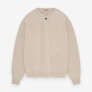 The Essentials Fine Knit Henley in Beige offers breathable comfort, a button placket, and a timeless, versatile design for everyday wear.